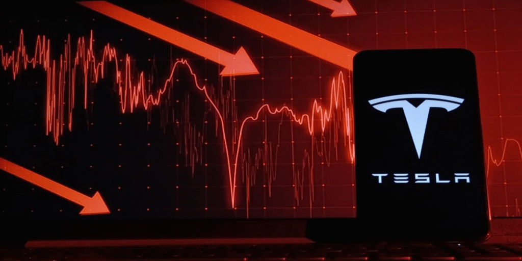 A mobile phone screen displaying the Tesla logo in bold white against a black background, juxtaposed with a downward-trending red stock chart showing a 7% drop in Tesla stock price, symbolizing the market reaction to Elon Musk’s America Party and EV tax credit concerns in 2025.
