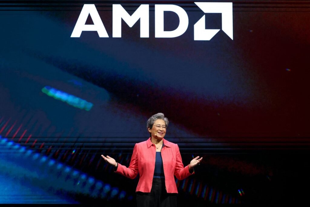AMD CEO on stage with AMD logo on top